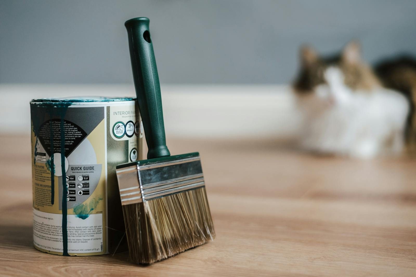Paint can and brush ready for an interior painting job